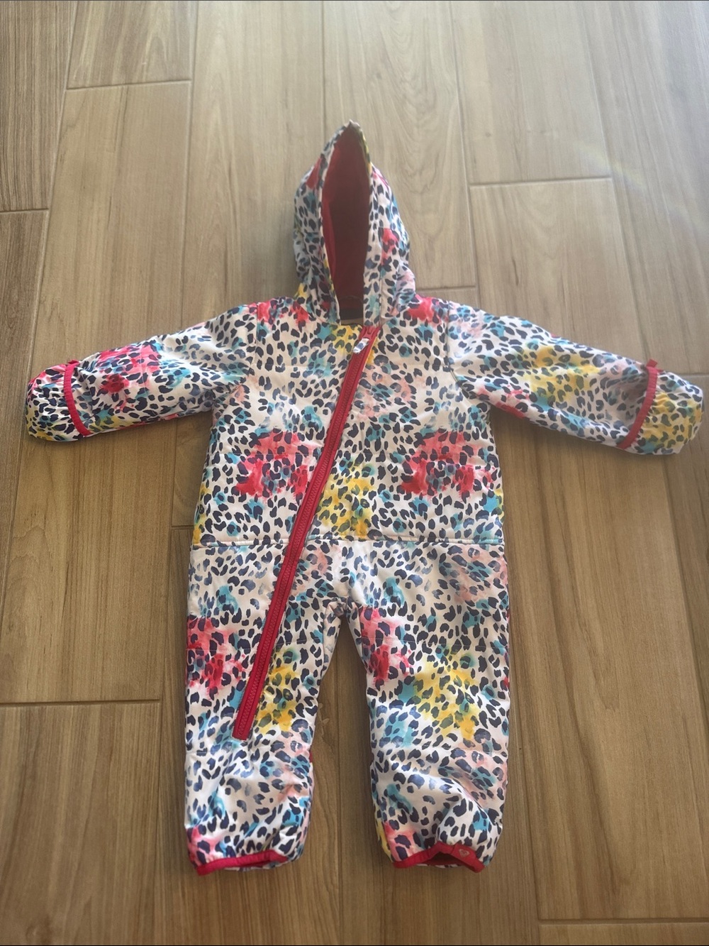 Roxy Kids One-Piece Bodysuit in White with Pink, Yellow & Blue Leopard Print